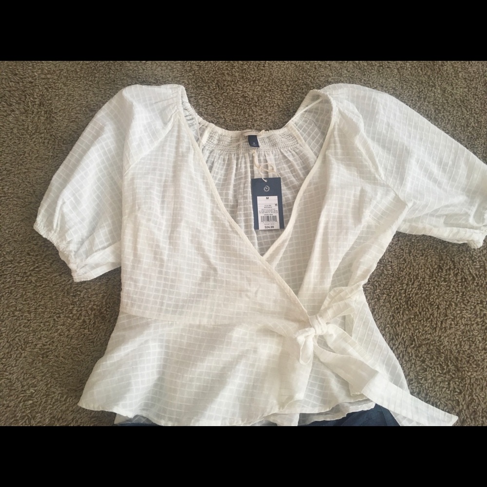 Rand new white tie shirt.
